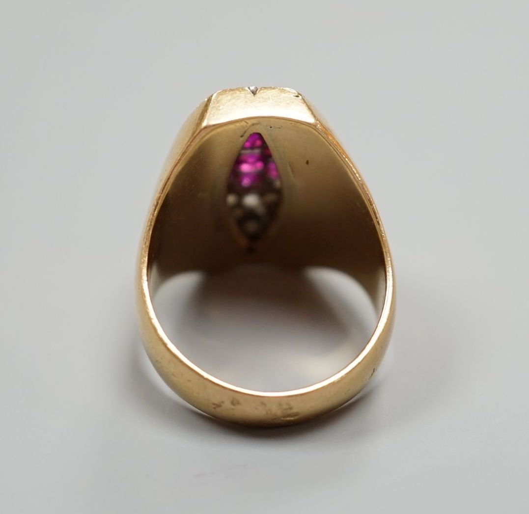 A French yellow metal (18ct poincon mark), ruby and rose cut diamond cluster set marquise shaped dress ring, size M, gross weight 11.3 grams.